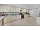 Spacious kitchen featuring granite countertops and updated cabinetry at 2131 Diamond Bar Dr, Las Vegas, NV 89117