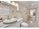 Clean bathroom with updated vanity, toilet and mirror at 2131 Diamond Bar Dr, Las Vegas, NV 89117