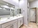 Bathroom with double sinks, a soaking tub, and a separate shower at 4 Kennesaw Rd, Henderson, NV 89052