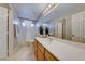 Bright bathroom featuring a single vanity and bathtub at 357 Whispering Tree Ave, Las Vegas, NV 89183