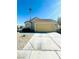 House exterior with a yellow front door, landscaped yard, and a driveway at 2736 Cathedral Ln, Las Vegas, NV 89108