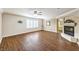 Main bedroom with hardwood floors and a fireplace at 4045 Abernethy Forest Pl, Las Vegas, NV 89141