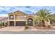 Two-story house with a two car garage and balcony at 4045 Abernethy Forest Pl, Las Vegas, NV 89141