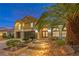 Two-story house with palm trees and stone accents at 4045 Abernethy Forest Pl, Las Vegas, NV 89141