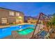 Refreshing pool and spa with a swing in the backyard at 4045 Abernethy Forest Pl, Las Vegas, NV 89141