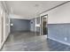 Gathering room with grey tile floors and blue accent walls at 7124 Pleasant View Ave, Las Vegas, NV 89147