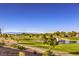 Golf course with pond, walking path, and mountain view at 2133 Desert Woods Dr, Henderson, NV 89012