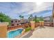 Deck overlooking a sparkling pool and backyard at 76 La Fiesta St, Henderson, NV 89012