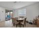 Bright dining area with table and chairs, opens to backyard at 6370 Ava Ridge Ave, Las Vegas, NV 89141