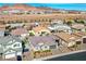 Aerial view showcasing the house and surrounding neighborhood in a desert setting at 1530 Washburn St, Boulder City, NV 89005