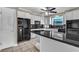 Island kitchen with granite countertop and stainless steel appliances at 5209 Westleigh Ave, Las Vegas, NV 89146