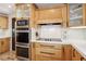 Modern kitchen with gas cooktop and light wood cabinets at 868 Marina Dr, Boulder City, NV 89005