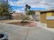 Large backyard with gravel and concrete patio areas, storage shed, and mature trees at 4406 Cinema Ave, North Las Vegas, NV 89031