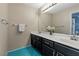 Double vanity bathroom with dark cabinetry at 2788 Quaker Ridge Rd, Las Vegas, NV 89142