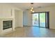 Bright living room with fireplace and sliding glass door to patio at 8621 Echo Grande Dr, Las Vegas, NV 89131