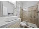 Bathroom featuring white vessel sink, sliding glass shower door, and tiled shower walls at 2840 Soaring Peak Ave, Henderson, NV 89052