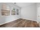 Bedroom with wood-style flooring and three large windows at 2840 Soaring Peak Ave, Henderson, NV 89052