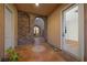 Charming courtyard entrance with stone archways and decorative tile at 2840 Soaring Peak Ave, Henderson, NV 89052