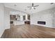 Open concept living area with a fireplace and view of the kitchen at 2840 Soaring Peak Ave, Henderson, NV 89052