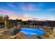 Aerial view of backyard featuring pool, spa, gazebo, and city views at 2840 Soaring Peak Ave, Henderson, NV 89052