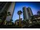 Luxury highrise condos with palm trees and city views at dusk at 322 Karen Ave # 3407, Las Vegas, NV 89109