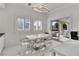 Kitchen breakfast nook with white table and chairs, and patio access at 47 Cascade Creek Ln, Las Vegas, NV 89113