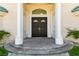 Impressive double front doors with decorative glass accents at 47 Cascade Creek Ln, Las Vegas, NV 89113