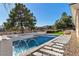 Inviting pool with a spa and serene landscape views at 47 Cascade Creek Ln, Las Vegas, NV 89113