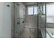 Elegant bathroom with a large soaking tub and walk-in shower at 9621 Verlaine Ct, Las Vegas, NV 89145