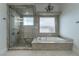 Bathroom features a walk-in shower and built-in bench at 9621 Verlaine Ct, Las Vegas, NV 89145