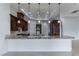 Large kitchen island with pendant lighting and granite countertops at 9621 Verlaine Ct, Las Vegas, NV 89145