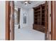 Home library with built-in bookcase and French doors at 9621 Verlaine Ct, Las Vegas, NV 89145