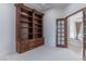 Bright office with built-in wooden bookcase and French doors at 9621 Verlaine Ct, Las Vegas, NV 89145