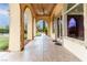 Covered patio with arched entryways and flagstone flooring at 9621 Verlaine Ct, Las Vegas, NV 89145