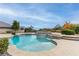 Relaxing pool area with a large patio and lush landscaping at 9621 Verlaine Ct, Las Vegas, NV 89145