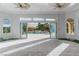 Sunroom with pool view, tile flooring, and sliding glass doors at 9621 Verlaine Ct, Las Vegas, NV 89145