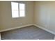 Simple bedroom with neutral walls and carpet flooring at 1037 Ferodale Ave, North Las Vegas, NV 89084