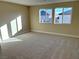 Bright bedroom featuring neutral walls and carpet at 1037 Ferodale Ave, North Las Vegas, NV 89084