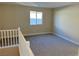 Spacious loft area with carpet flooring and window at 1037 Ferodale Ave, North Las Vegas, NV 89084