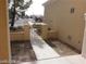 Sidewalk leading to gated entry of a tan house at 10404 Frostburg Ln, Las Vegas, NV 89134