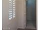 Bedroom with window shutters and access to another room at 1652 Black Fox Canyon Rd, Henderson, NV 89052