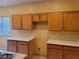 Kitchen with wood cabinets and ample counter space at 7667 Borealis St, Las Vegas, NV 89123