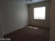 Simple bedroom with carpeted floor and window at 256 Camino Viejo St, Henderson, NV 89012