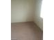 Small bedroom with carpeted floors and a window at 133 Mclaren St, Henderson, NV 89074