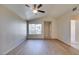 Bright living room with light walls and wood-look flooring at 5424 Comchec Way # 105, Las Vegas, NV 89108