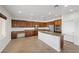 Spacious kitchen with wood cabinets and granite countertops at 2686 Kinghorn Pl, Henderson, NV 89044