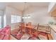 Dining area features wood flooring and a charming floral rug at 3133 La Mancha Way, Henderson, NV 89014