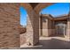 Stone archway entryway leading to the front door at 653 Paloma Cir, Mesquite, NV 89027