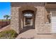 Stone archway entryway with a wrought iron gate at 653 Paloma Cir, Mesquite, NV 89027