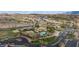 Aerial view of community with pool, tennis courts, and golf course at 653 Paloma Cir, Mesquite, NV 89027